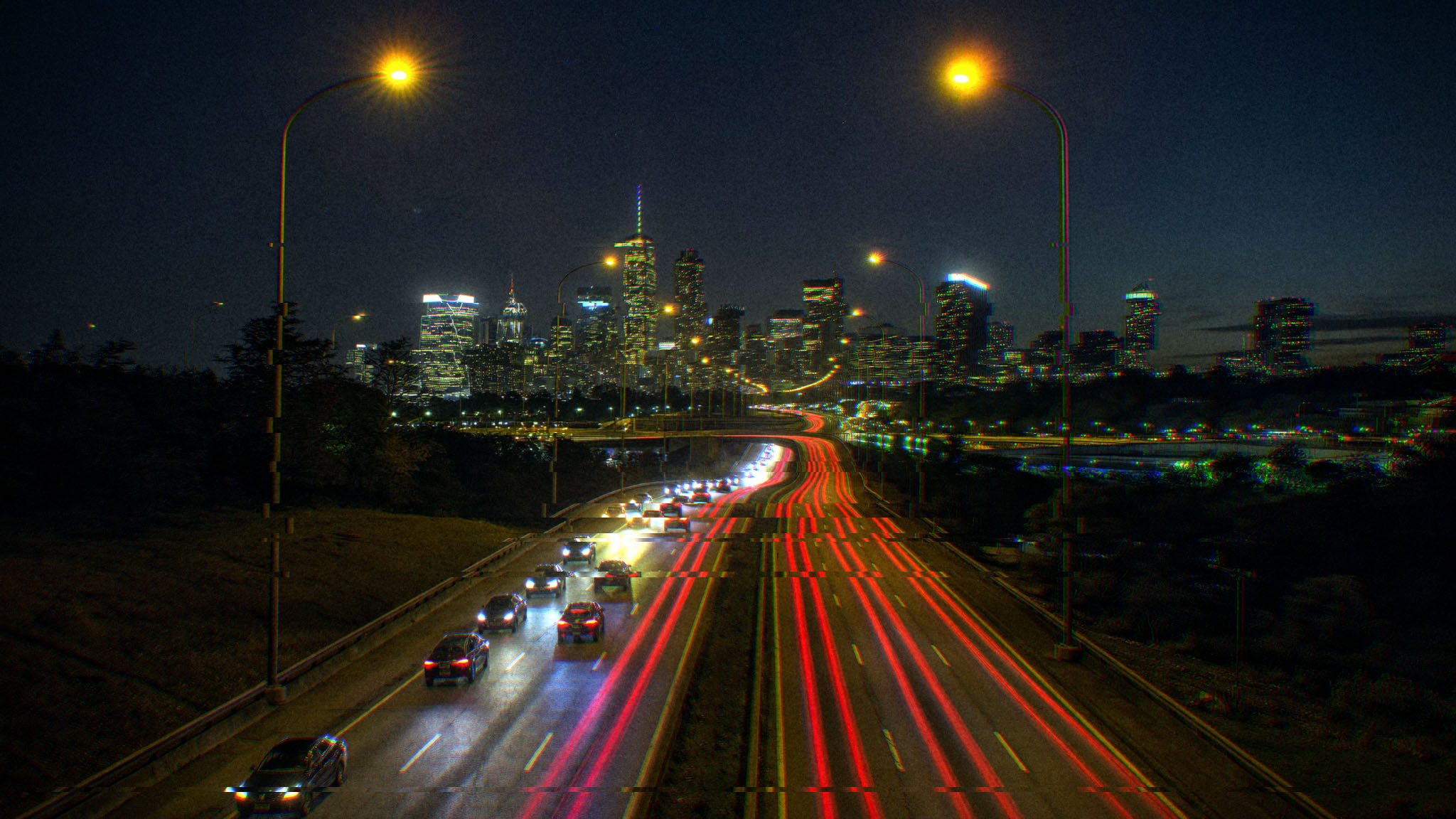 Highway light trails, night after Halobloom: Bloom, Chromatic Aberration, Film Grain, Film Looks, Glitch, Vignette